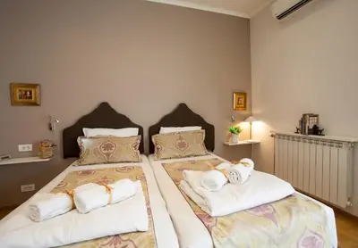 two beds in a room with towels on them at Belle Apartments - Luxury Apartments in Belgrade