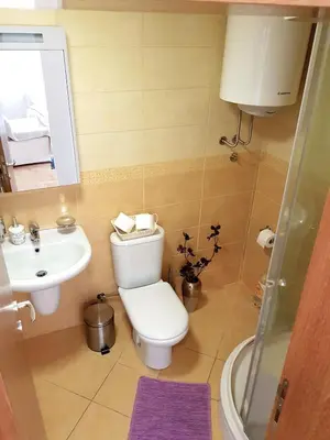 a bathroom with a toilet and a sink at Shining in Belgrade