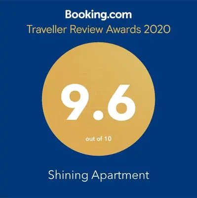 a yellow circle with the text travelling review awards shining enchantment at Shining in Belgrade