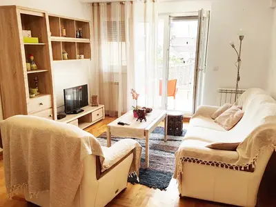 a living room with a couch and a table at Shining in Belgrade