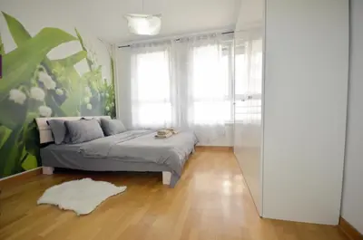 a bedroom with a bed and a window at Clean&Cozy Apartments Novi Beograd in Belgrade