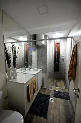 a bathroom with a sink and a shower at Clean&Cozy Apartments Novi Beograd in Belgrade