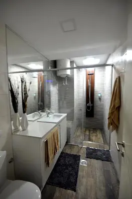 a bathroom with a sink and a toilet and a shower at Clean&Cozy Apartments Novi Beograd in Belgrade