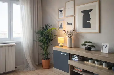a living room with a shelf with plants and a window at City Break Apartments - City Zen in Belgrade