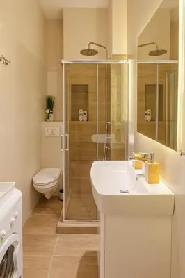 a bathroom with a shower and a sink and a toilet at City Break Apartments - City Zen in Belgrade