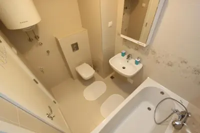a bathroom with a sink and a toilet and a tub at Riviera 2 New Belgrade studio apartment, parking 5 evra dan in Belgrade