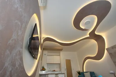 a living room with a tv on a wall at Riviera 2 New Belgrade studio apartment, parking 5 evra dan in Belgrade