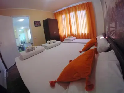 a bedroom with two beds with stuffed animals on them at Balkan-inn Skadarlija 2 apartment in Belgrade