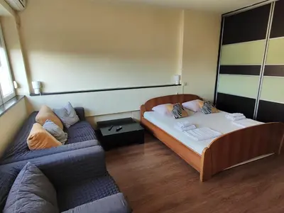 a small room with two beds and a couch at Balkan-inn Studio Centar apartment in Belgrade