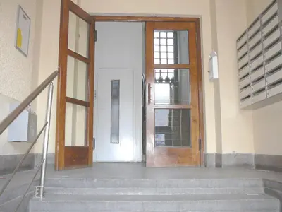 an open door in a building with stairs at Balkan-inn Studio Centar apartment in Belgrade
