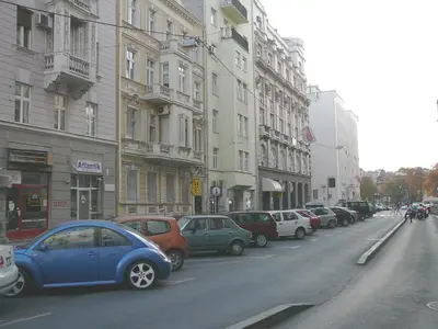a row of cars parked on a city street at Balkan-inn Studio Centar apartment in Belgrade