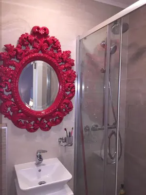 a bathroom with a red mirror and a sink at Balkan-inn Parlament Lux apartment in Belgrade