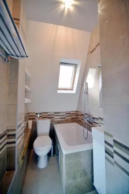 a bathroom with a toilet and a tub and a sink at Fd.Eight Apartment in Belgrade