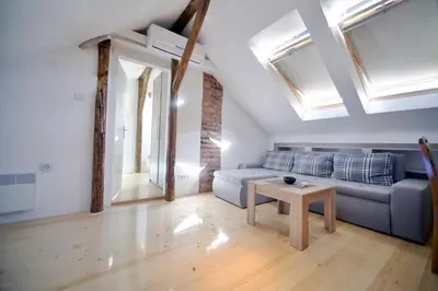 a living room with a couch and a table at Fd.Eight Apartment in Belgrade