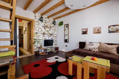 a living room with a couch and a table at Apartment 14 in Belgrade