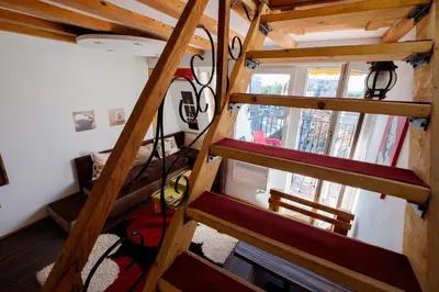 a spiral staircase in a tiny house at Apartment 14 in Belgrade
