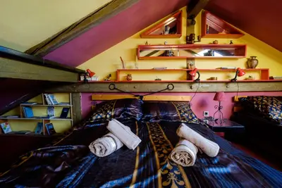 a bedroom with a bed with two towels on it at Apartment 14 in Belgrade