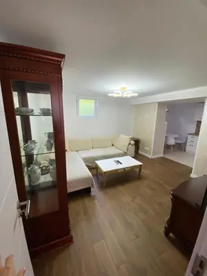 a living room with a couch and a table at Baron Apartment in Belgrade
