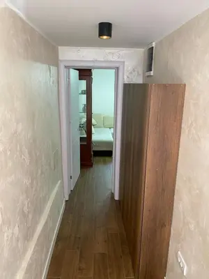 a hallway with a door leading to a bedroom at Baron Apartment in Belgrade