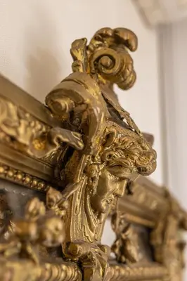 a gold statue of a lion with a pair of scissors at Max Luxury Apartments in Belgrade