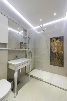 a bathroom with a sink and a glass shower at Max Luxury Apartments in Belgrade