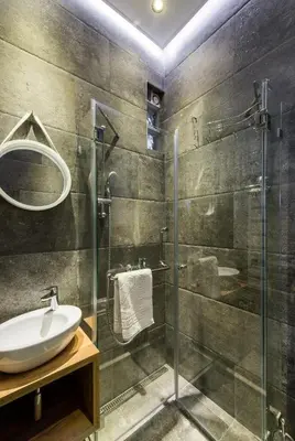 a bathroom with a glass shower and a sink at Max Luxury Apartments in Belgrade