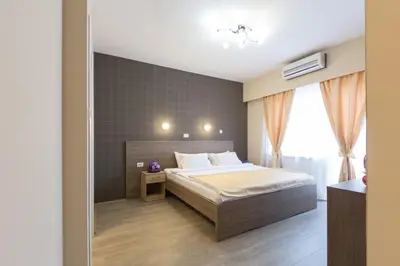 a bedroom with a bed and a window at Sabor in Belgrade