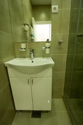 a bathroom with a sink and a shower at Apartments Jevremova in Belgrade