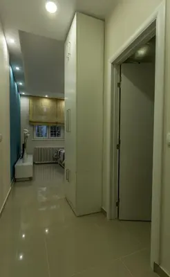 a hallway with an open door to a kitchen at Apartments Jevremova in Belgrade