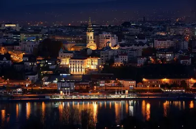 a view of a city at night at Apartment Greenfield in Belgrade