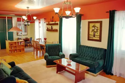 a living room with a couch and chairs and a table at Marilyn Apartments in Smederevo