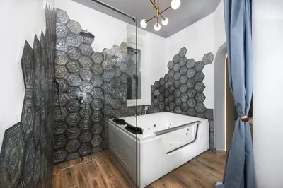 a bathroom with a sink and a wall with logs at Belgrade CITY CENTER Apartments PARKING 12e - 7 min by walk TERAZIJE in Belgrade