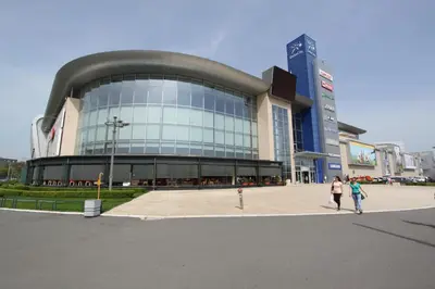 a large building with people walking in front of it at New Belgrade Apartments Magnetic, parking 5 evra dan in Belgrade