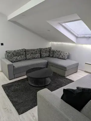 a living room with a couch and a table at Top Belgrade Apartments in Belgrade