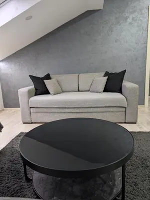 a living room with a couch and a table at Top Belgrade Apartments in Belgrade