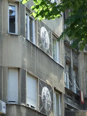 a building with clocks on the side of it at Enjoy Belgrade in Belgrade