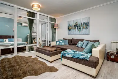 a living room with a couch and a bed at French House in Belgrade
