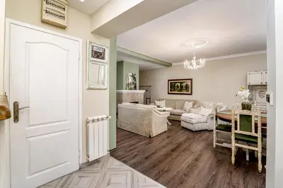 a room with a white door and a living room at French House in Belgrade