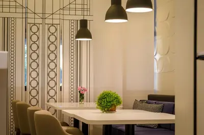 a dining room with a table and chairs at Passport Belgrade in Belgrade