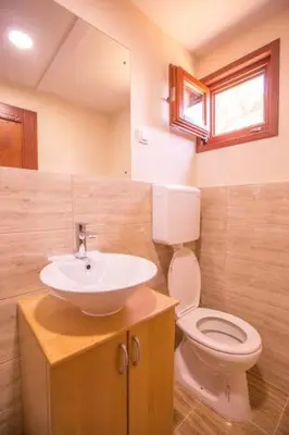 a bathroom with a sink and a toilet at Green House Hostel in Belgrade