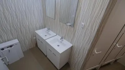 a bathroom with a white sink and a mirror at Stella Di Notte in Belgrade