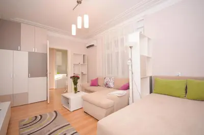 a living room with a bed and a couch at Apartment Mina in Belgrade
