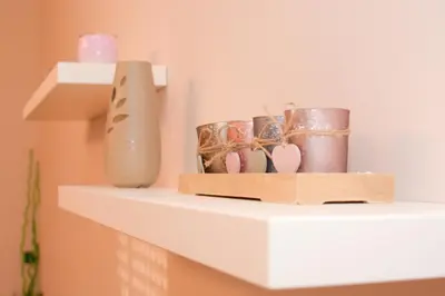 a shelf with vases and a box on it at Apartment Mina in Belgrade