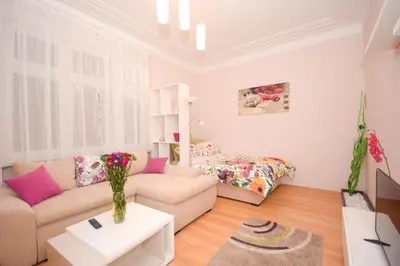 a living room with a couch and a bed at Apartment Mina in Belgrade