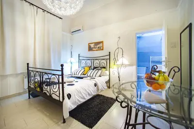 a bedroom with a bed and a glass table at Central charm modern 2br apt-Free parking near in Belgrade