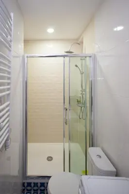 a bathroom with a shower and a toilet at Downtown Star Apartment in Belgrade