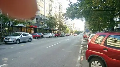 a street with cars parked on the side of the road at Apartment Zindan in Belgrade