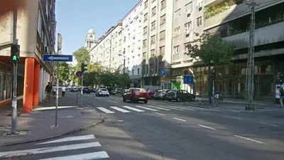 an empty city street with cars driving down the street at Apartment Zindan in Belgrade