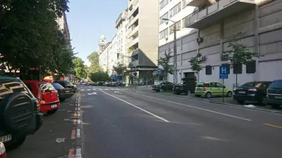 a city street with cars parked on the side of the road at Apartment Zindan in Belgrade