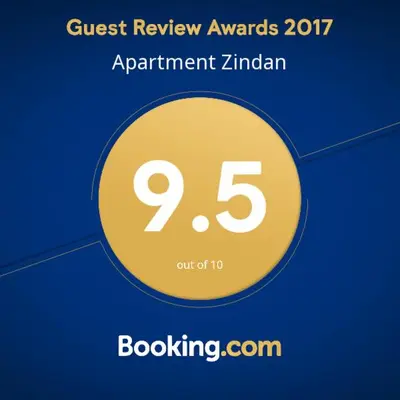 a yellow circle with the words quest review awards appointment zimbabwe at Apartment Zindan in Belgrade